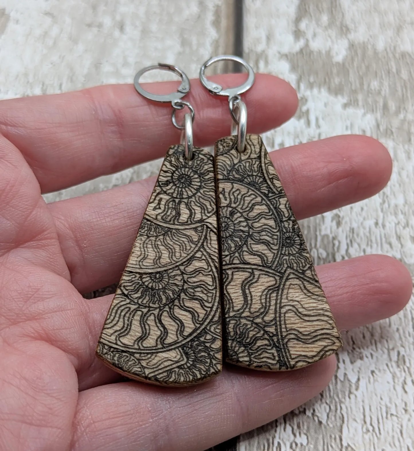 Lace wood Wooden roimata ammonite laser printed drop earrings with stainless steel findings.
