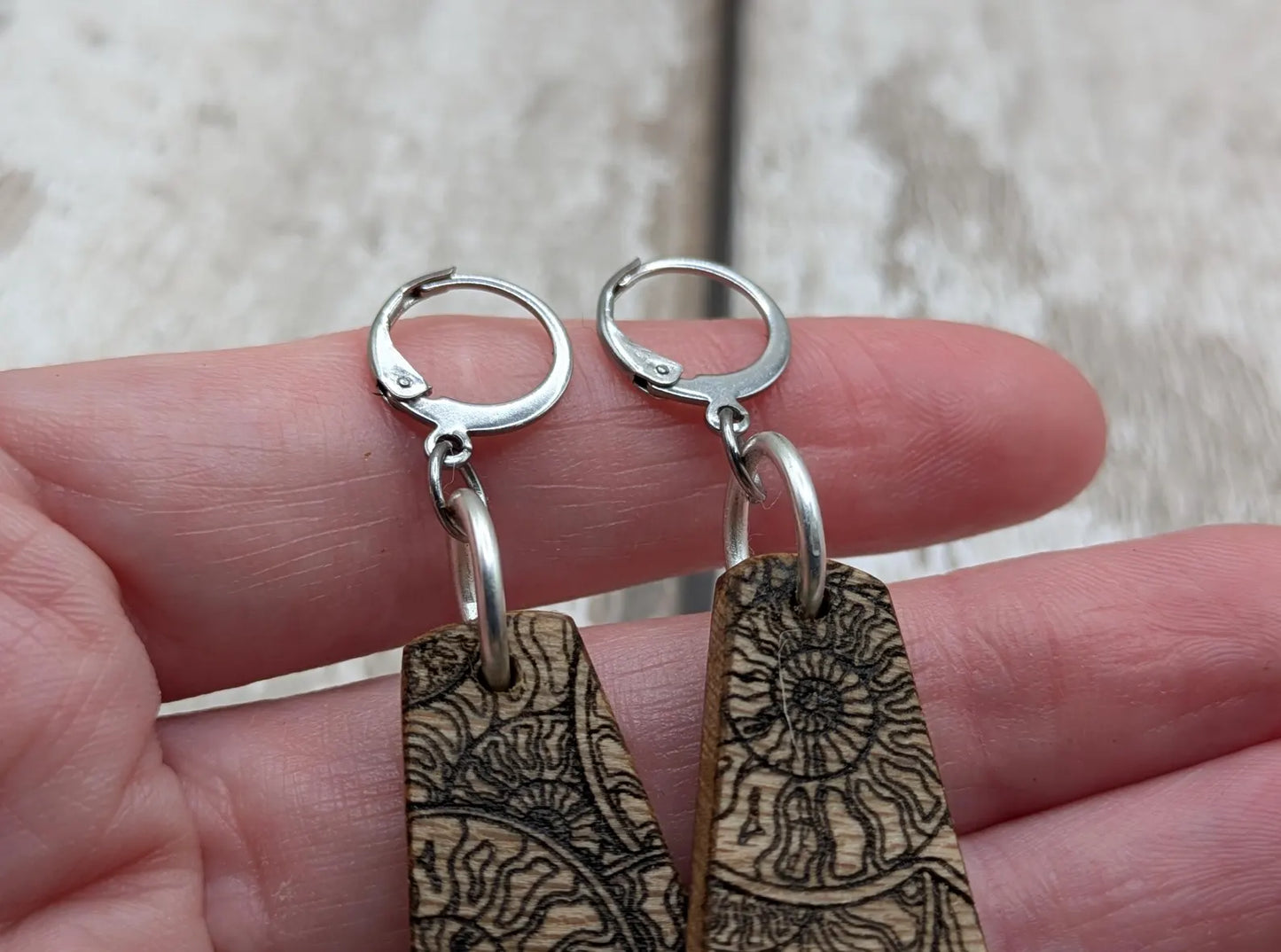 Lace wood Wooden roimata ammonite laser printed drop earrings with stainless steel findings.