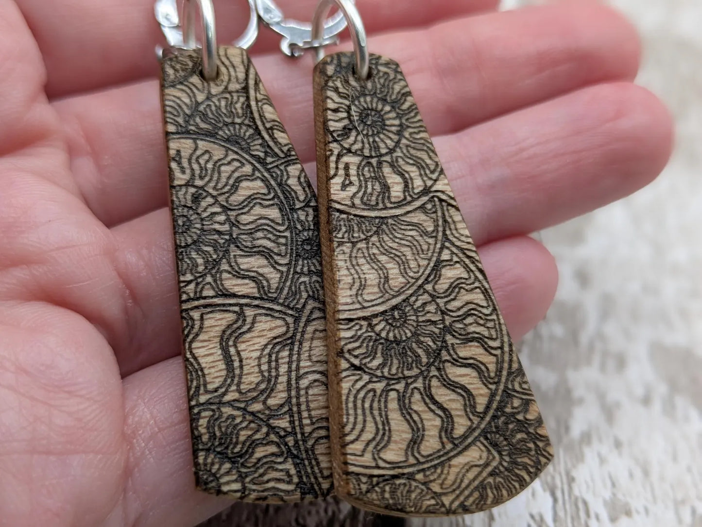 Lace wood Wooden roimata ammonite laser printed drop earrings with stainless steel findings.