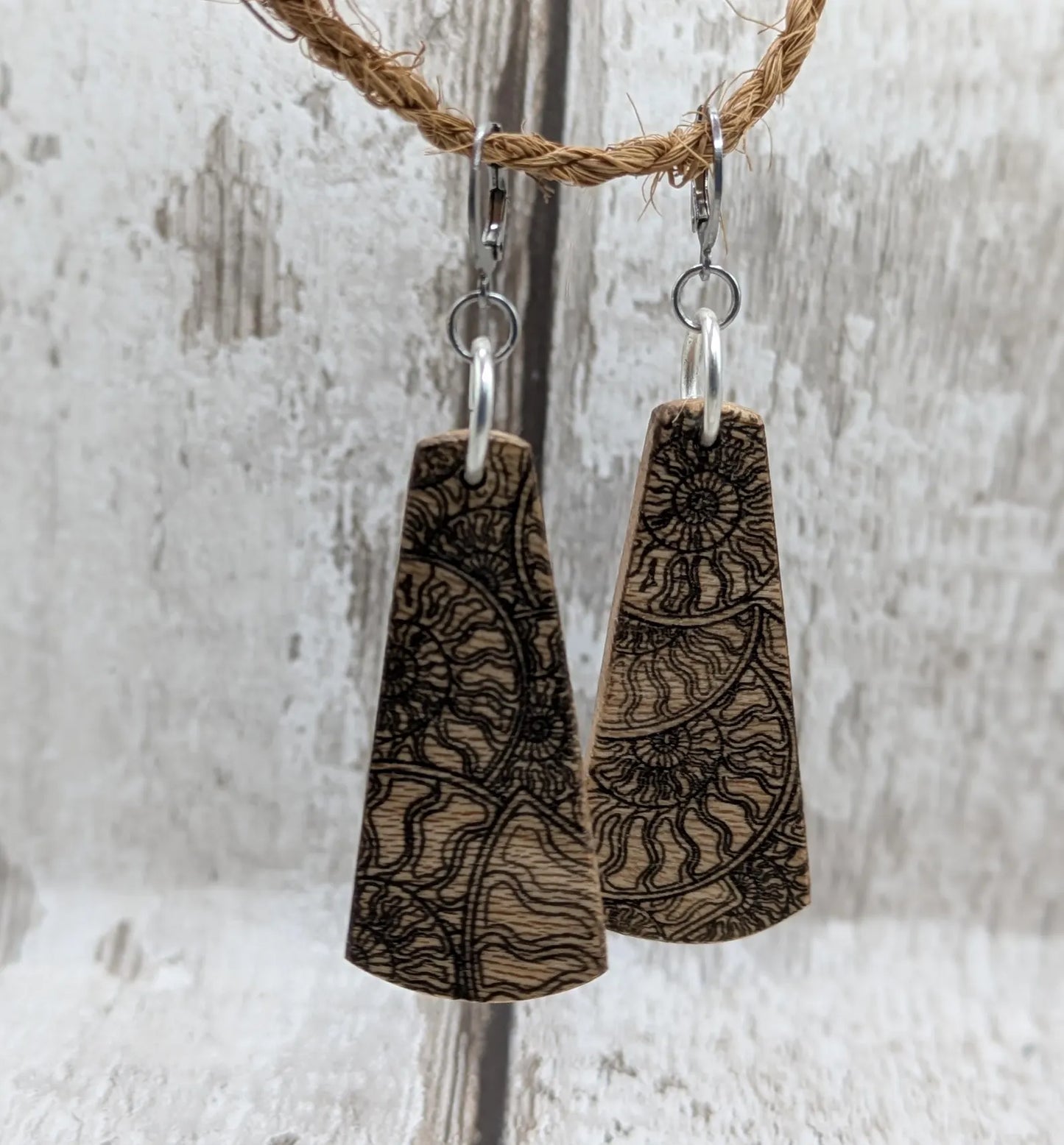 Lace wood Wooden roimata ammonite laser printed drop earrings with stainless steel findings.