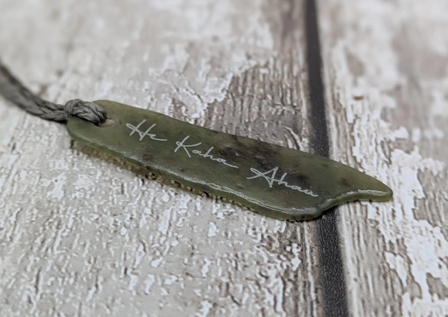 New Zealand pounamu greenstone jade pendant, he kaha ahau, I am strong affirmation.