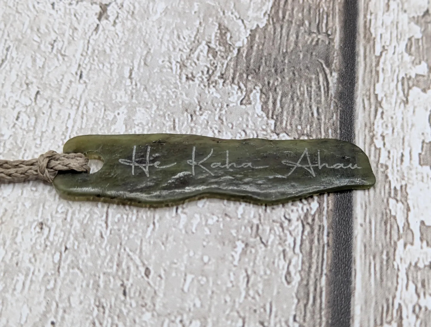 New Zealand tumbled Pounamu greenstone with I am strong in te Reo Māori affirmation.