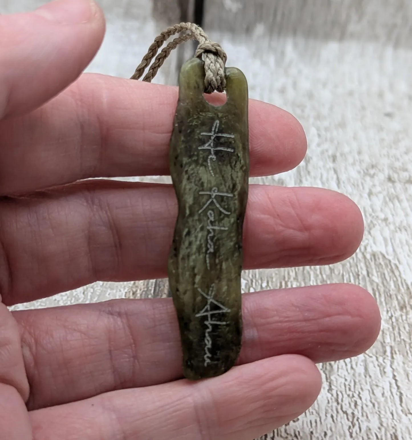 New Zealand tumbled Pounamu greenstone with I am strong in te Reo Māori affirmation.