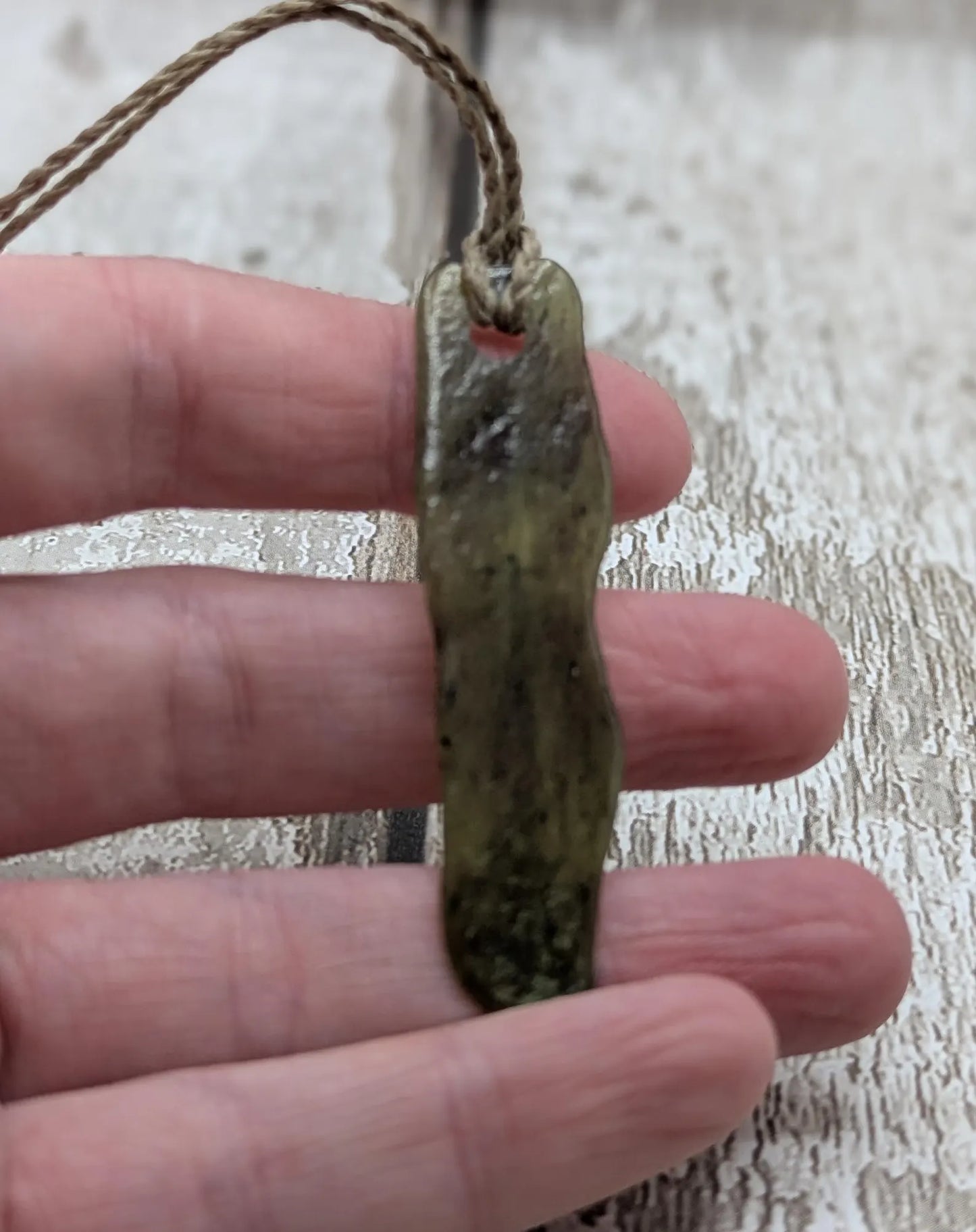 New Zealand tumbled Pounamu greenstone with I am strong in te Reo Māori affirmation.