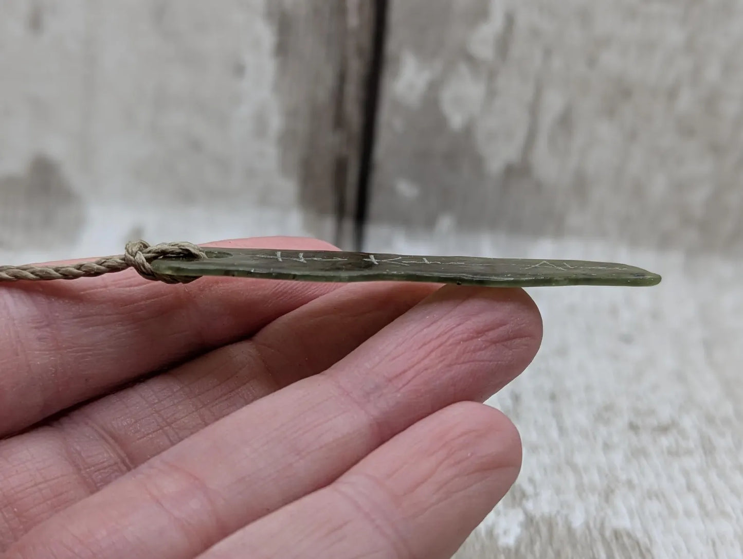New Zealand tumbled Pounamu greenstone with I am strong in te Reo Māori affirmation.