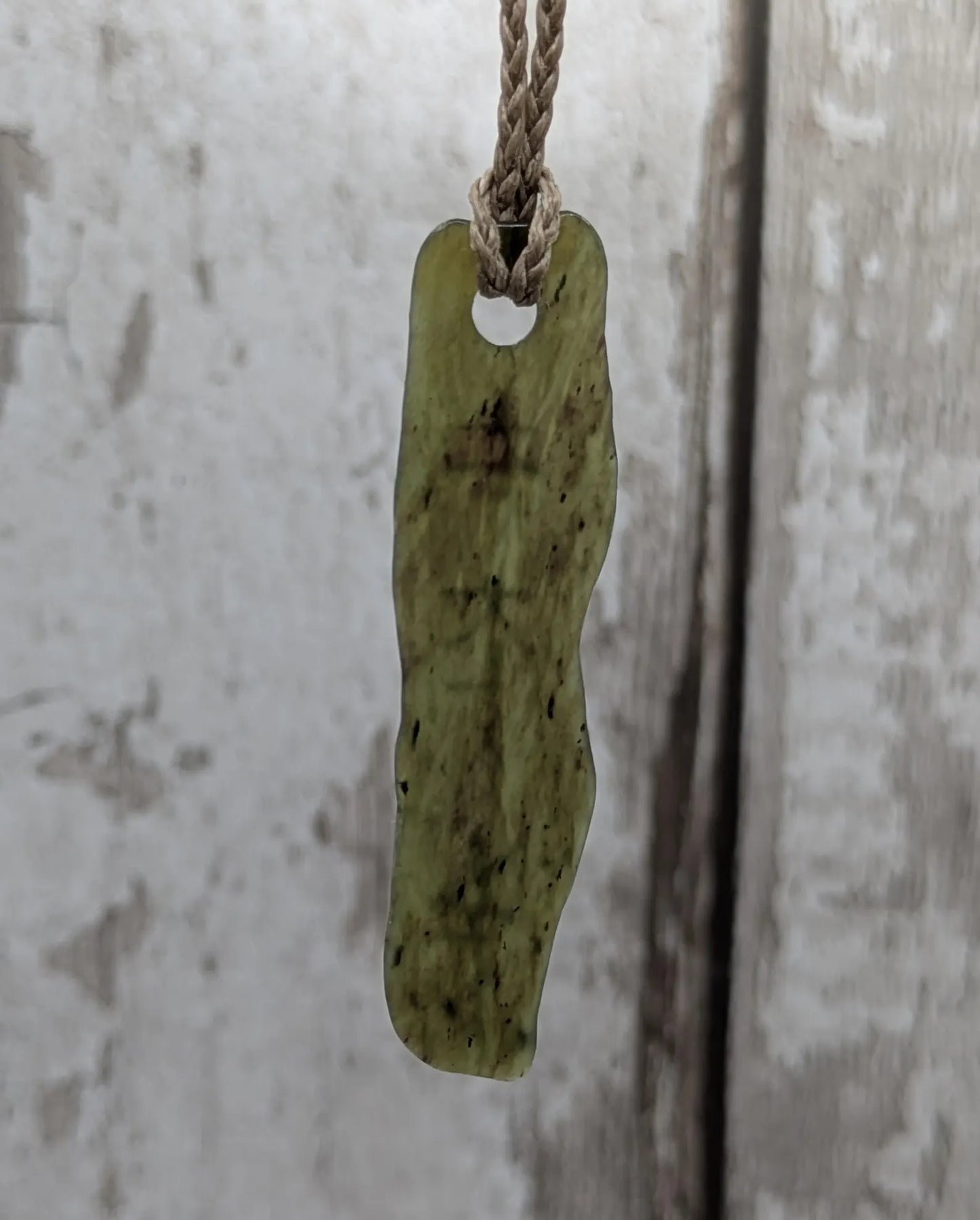 New Zealand tumbled Pounamu greenstone with I am strong in te Reo Māori affirmation.