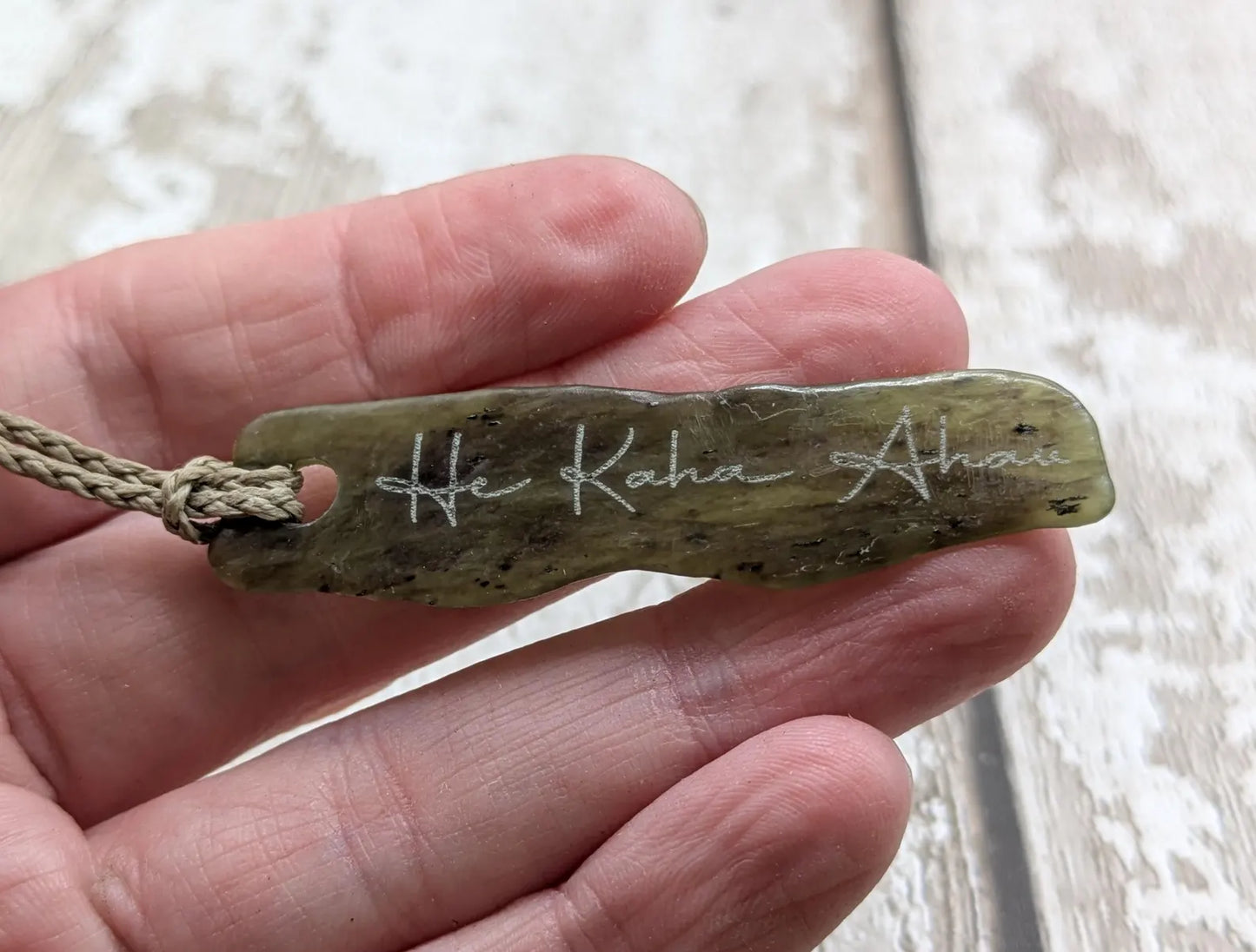New Zealand tumbled Pounamu greenstone with I am strong in te Reo Māori affirmation.
