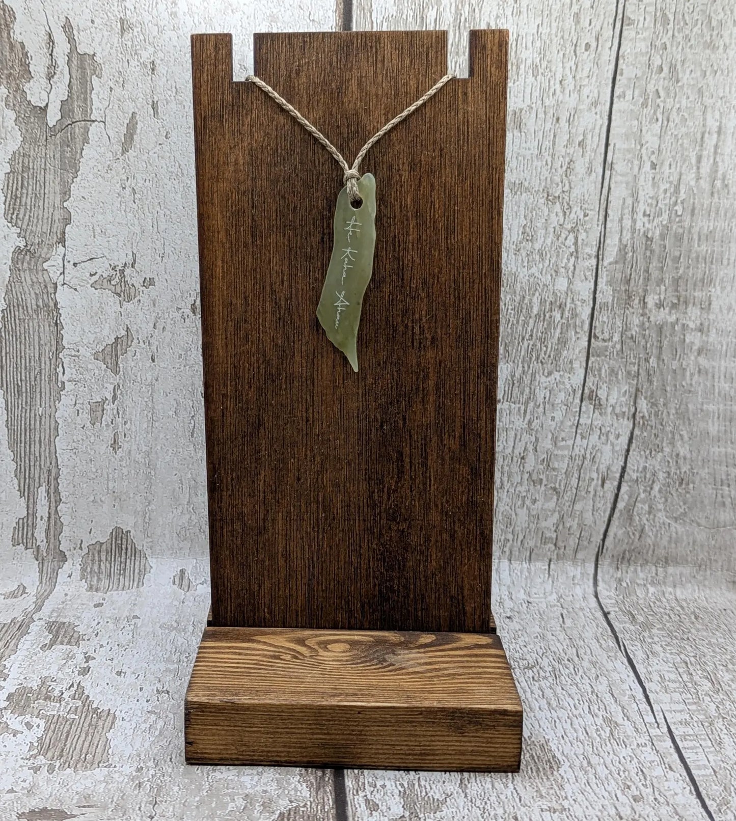 New Zealand tumbled Pounamu greenstone pendant with I am strong in te Reo Māori.