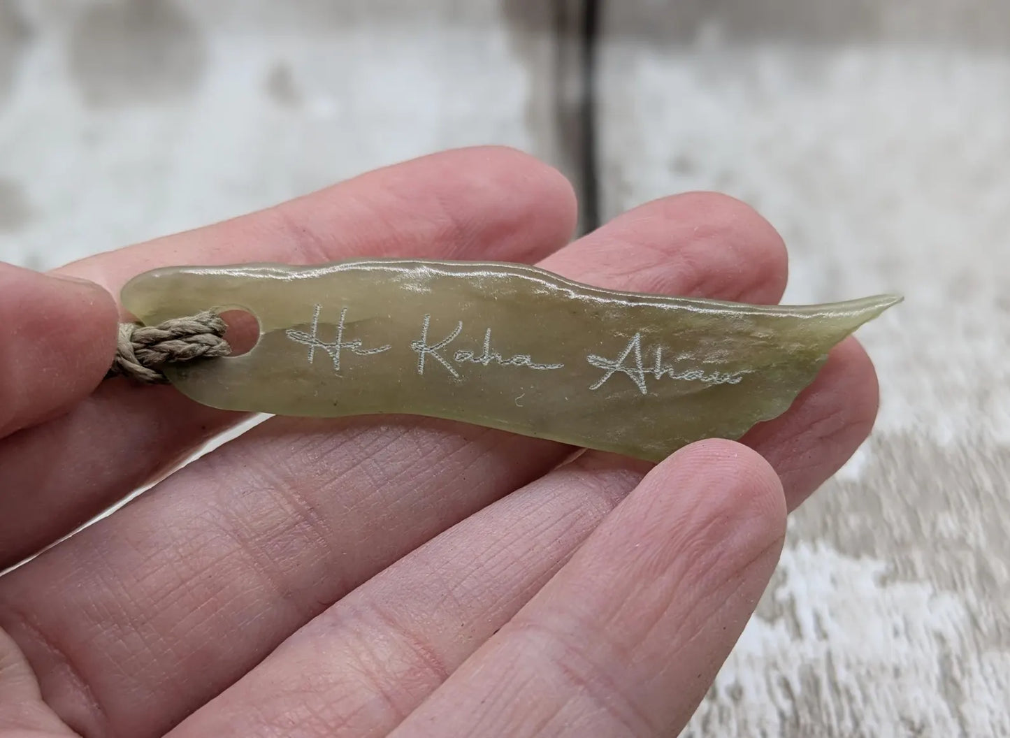New Zealand tumbled Pounamu greenstone pendant with I am strong in te Reo Māori.
