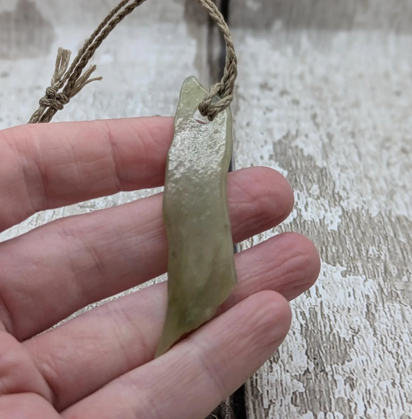 New Zealand tumbled Pounamu greenstone pendant with I am strong in te Reo Māori.