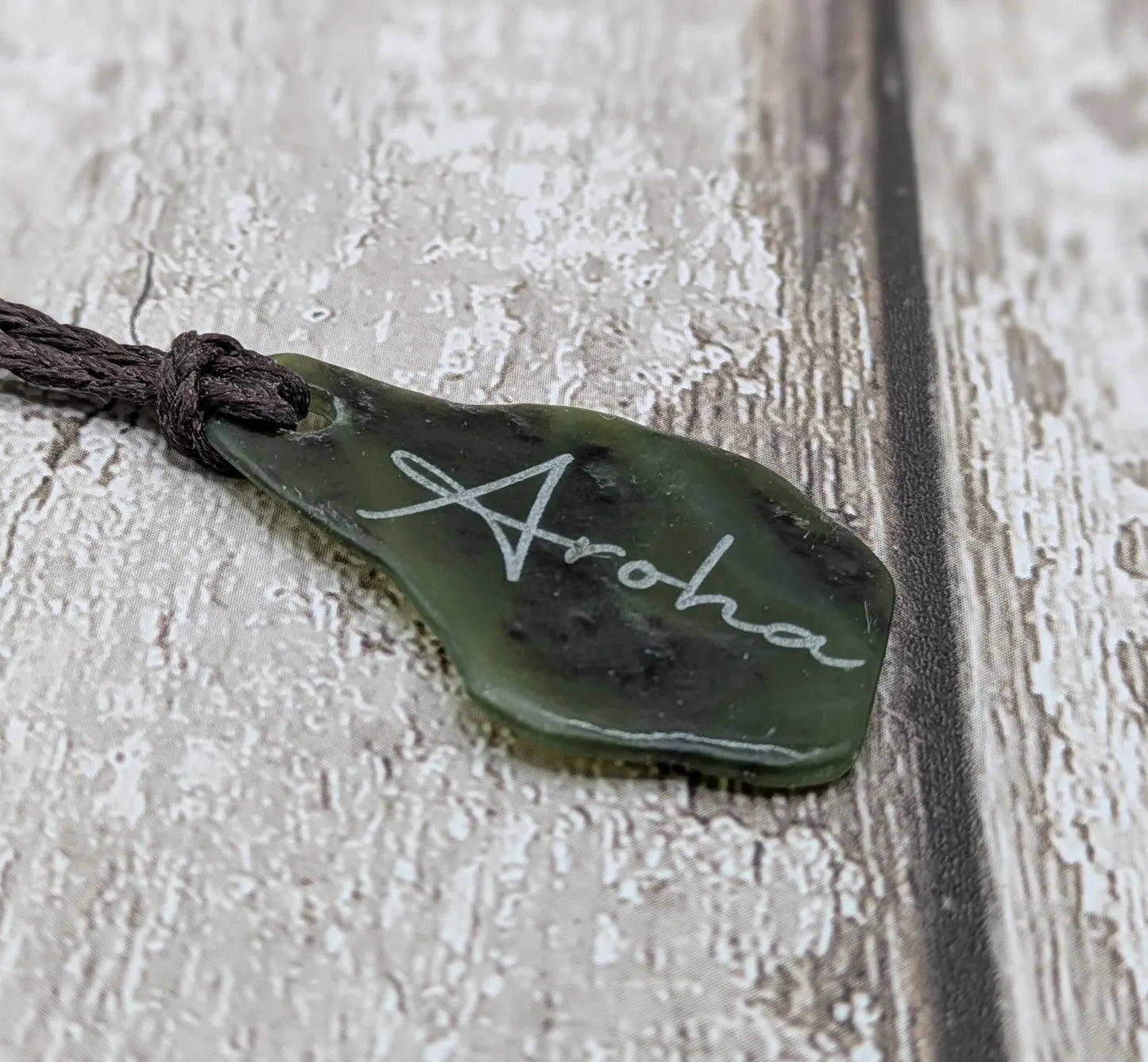 Tumbled New Zealand Pounamu greenstone pendant with love in te Reo Māori