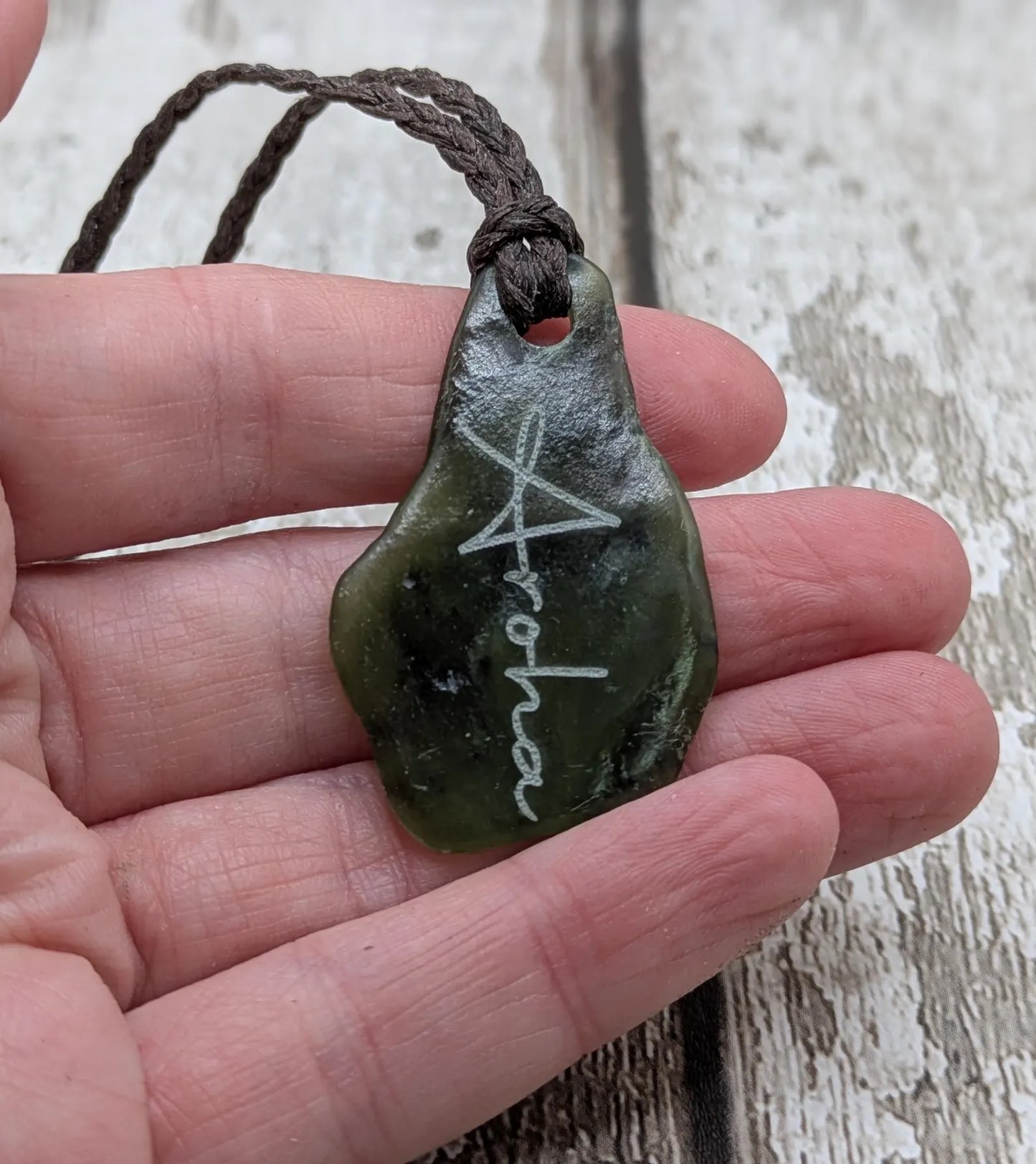 Tumbled New Zealand Pounamu greenstone pendant with love in te Reo Māori