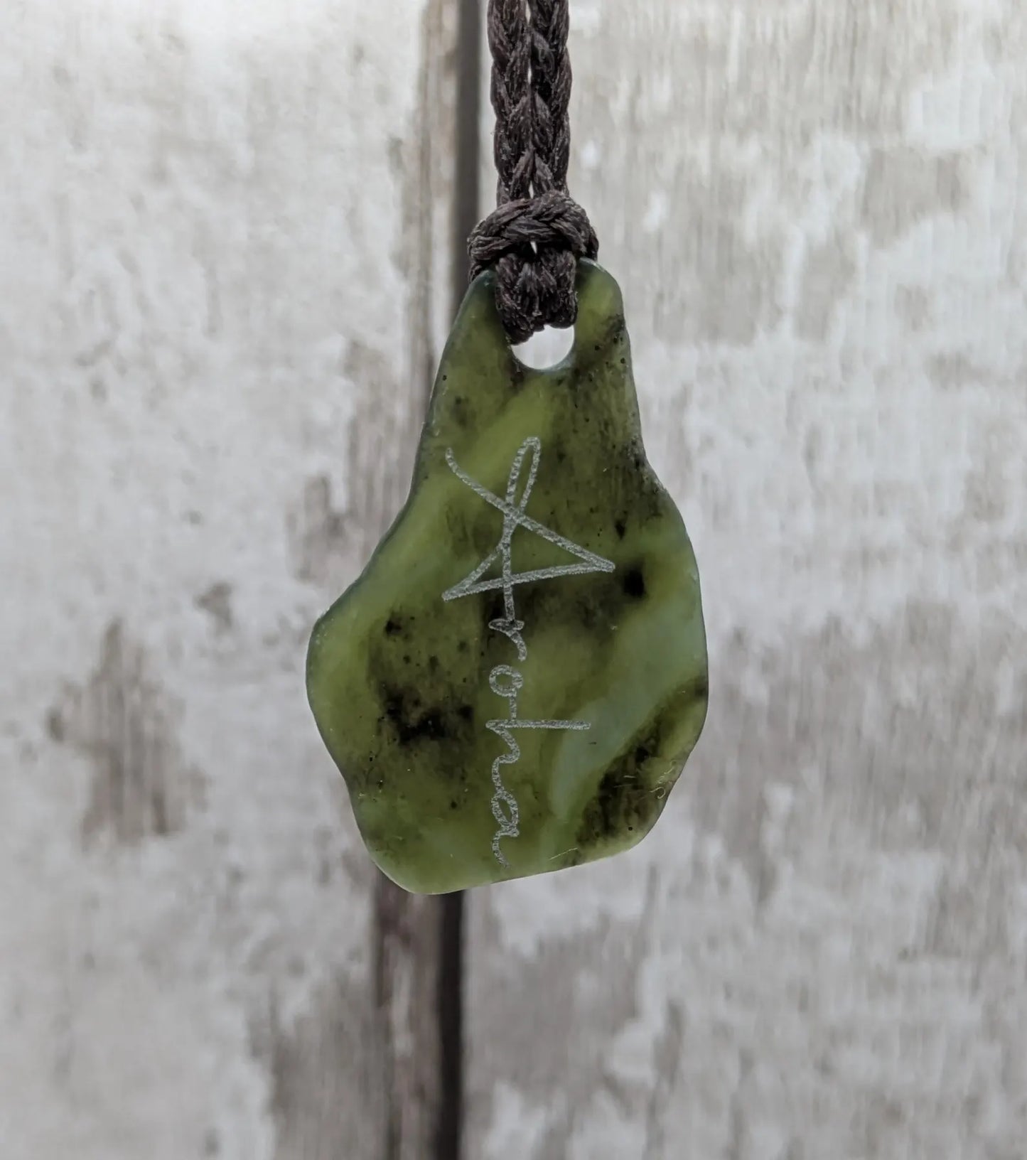 Tumbled New Zealand Pounamu greenstone pendant with love in te Reo Māori