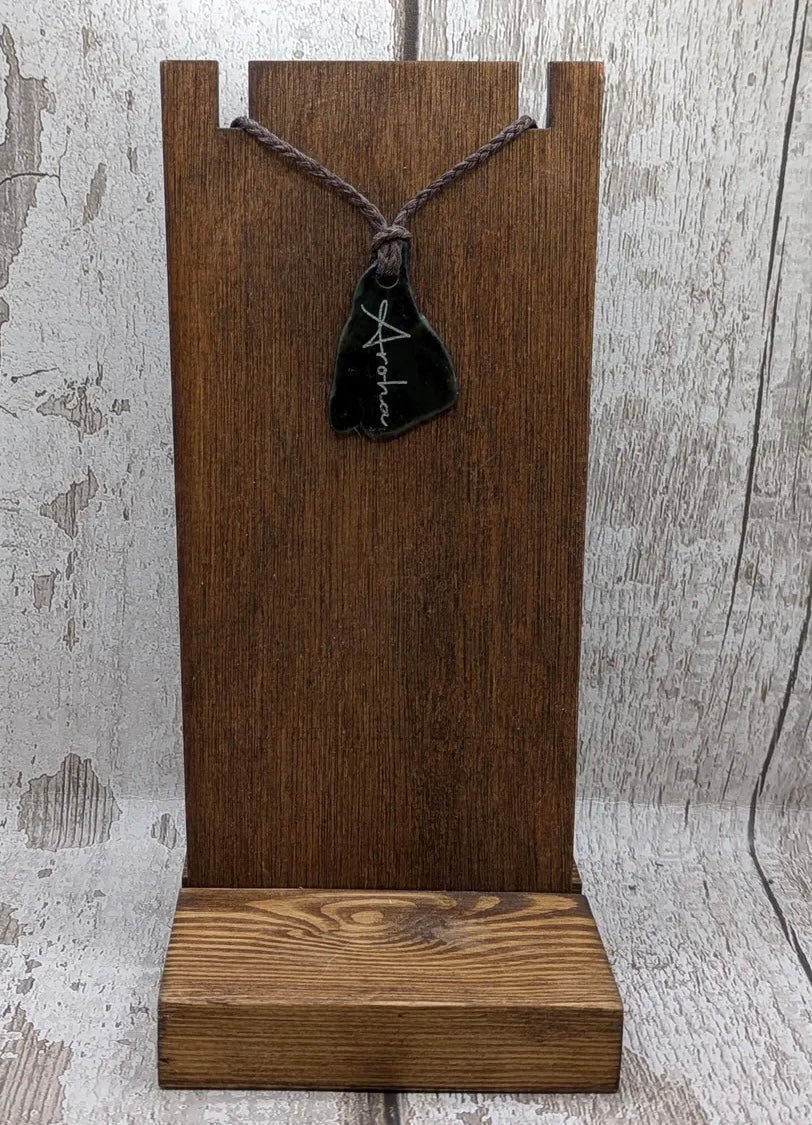 Nz tumbled Pounamu greenstone pendant with Aroha love affirmation.