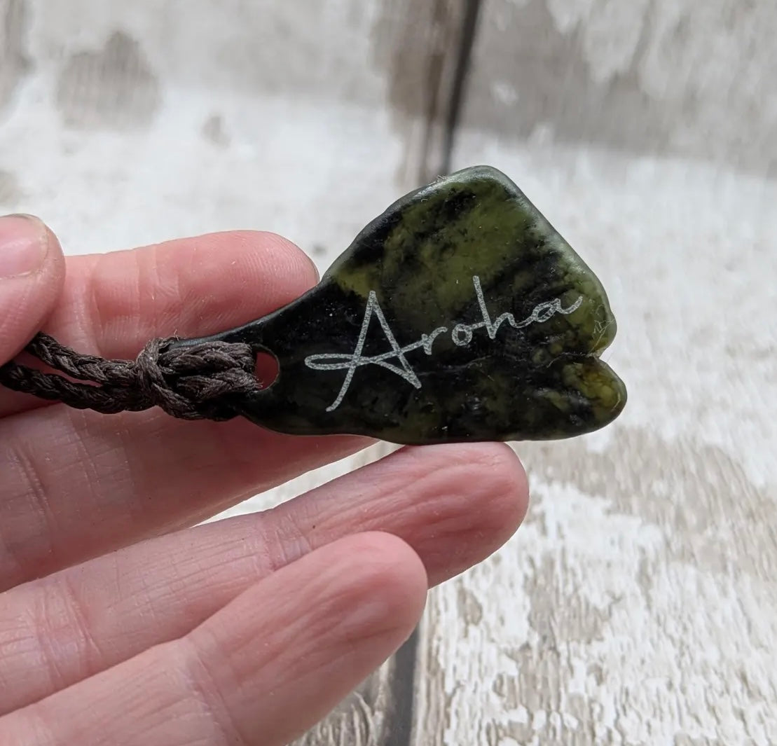 Nz tumbled Pounamu greenstone pendant with Aroha love affirmation.