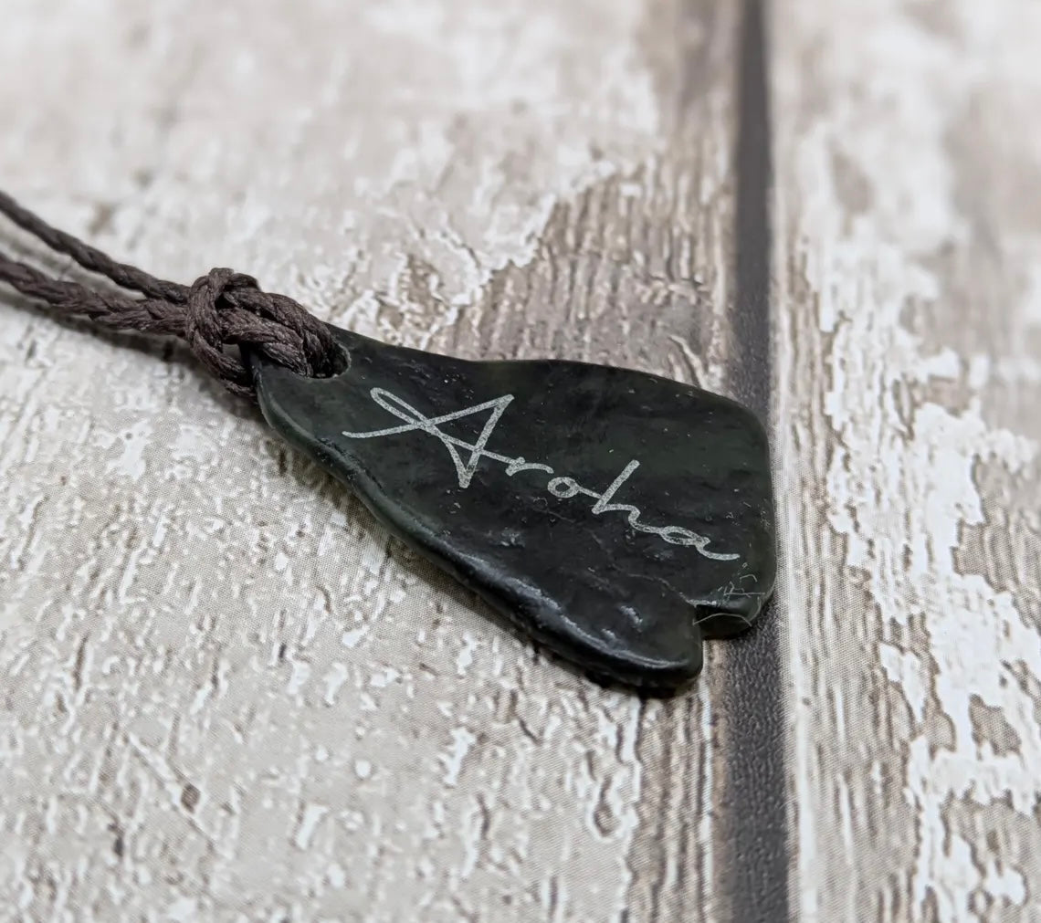Nz tumbled Pounamu greenstone pendant with Aroha love affirmation.