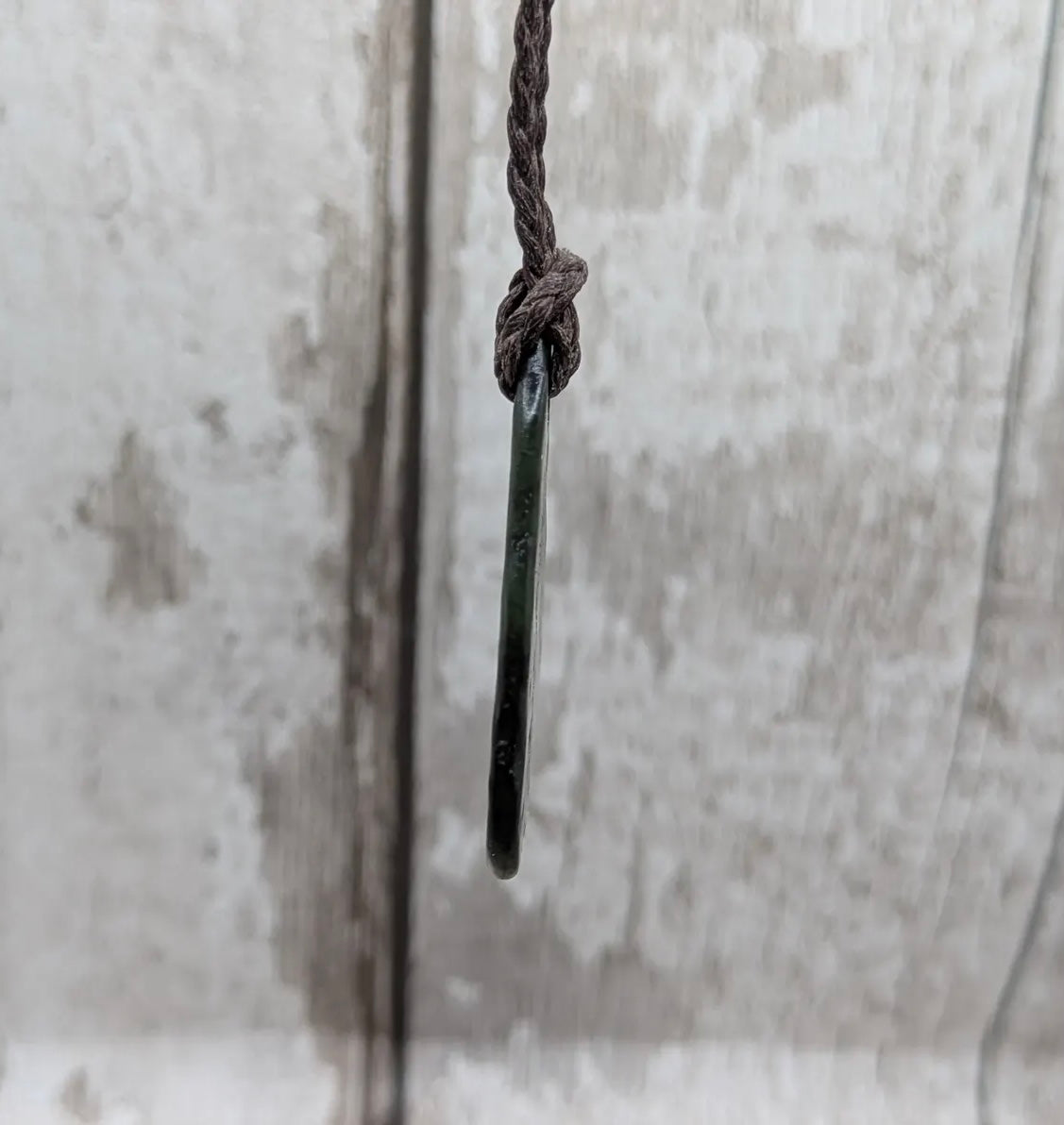 Nz tumbled Pounamu greenstone pendant with Aroha love affirmation.