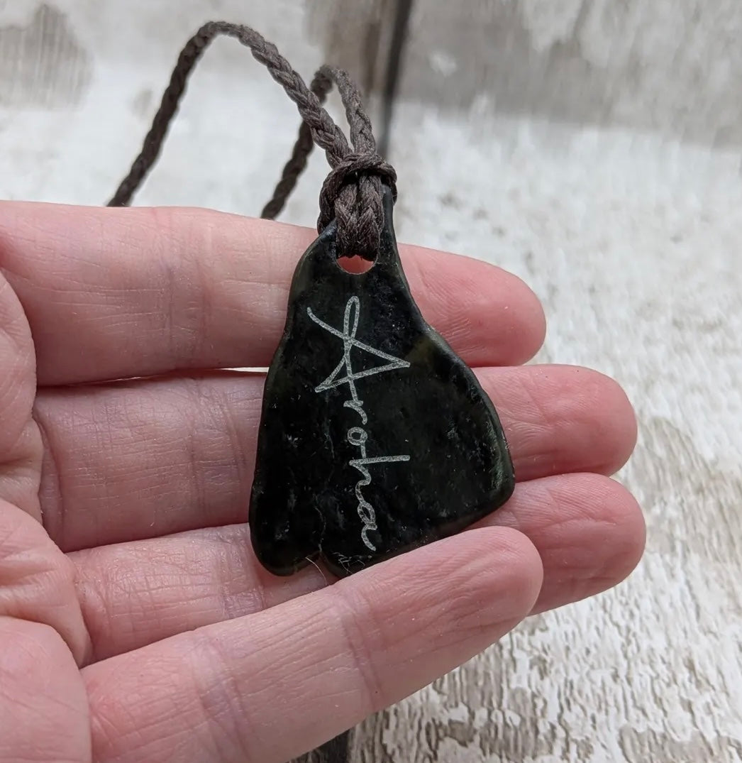 Nz tumbled Pounamu greenstone pendant with Aroha love affirmation.