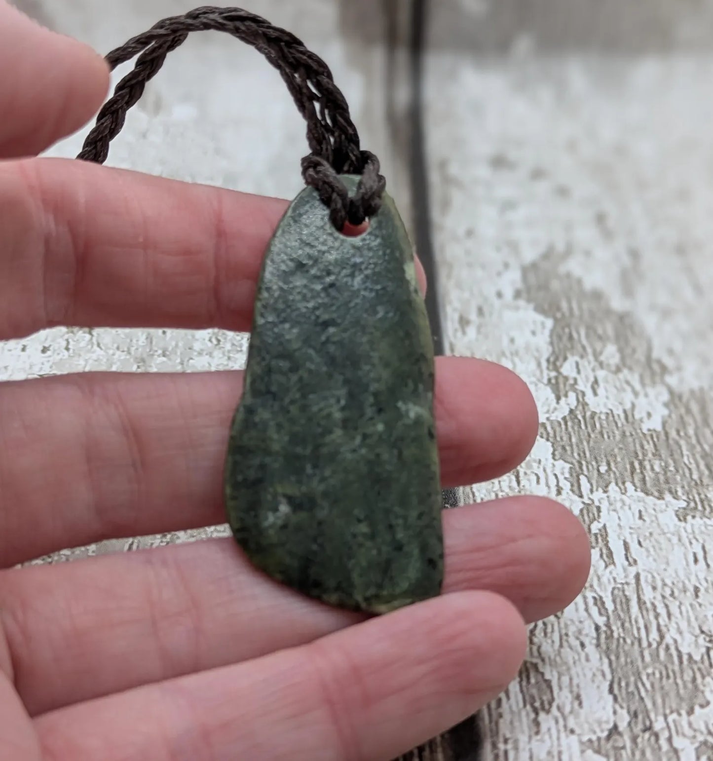 Nz tumble polished Pounamu jade pendant with Aroha love affirmation.