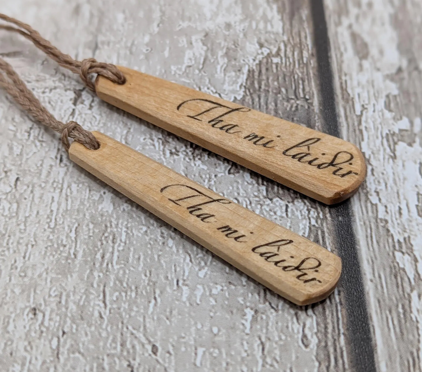 Lime wood Scots Gaelic Tha Mi Láidir, I am strong roimata drop pendant.