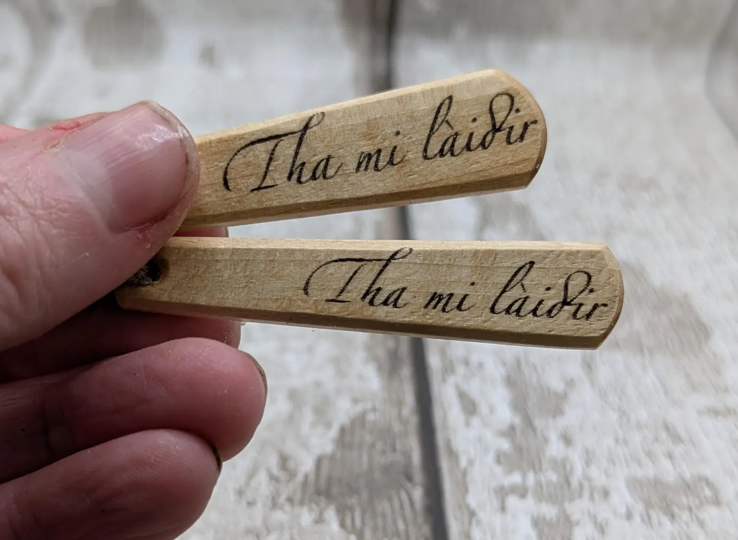 Lime wood Scots Gaelic Tha Mi Láidir, I am strong roimata drop pendant.