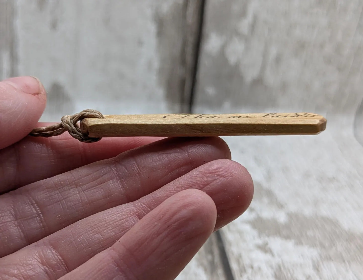 Lime wood Scots Gaelic Tha Mi Láidir, I am strong roimata drop pendant.