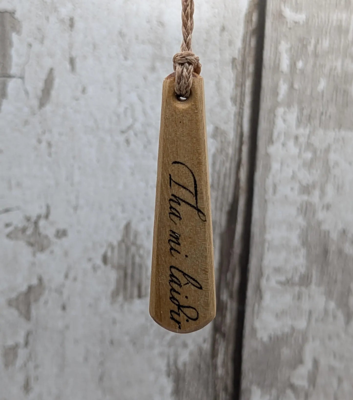 Lime wood Scots Gaelic Tha Mi Láidir, I am strong roimata drop pendant.