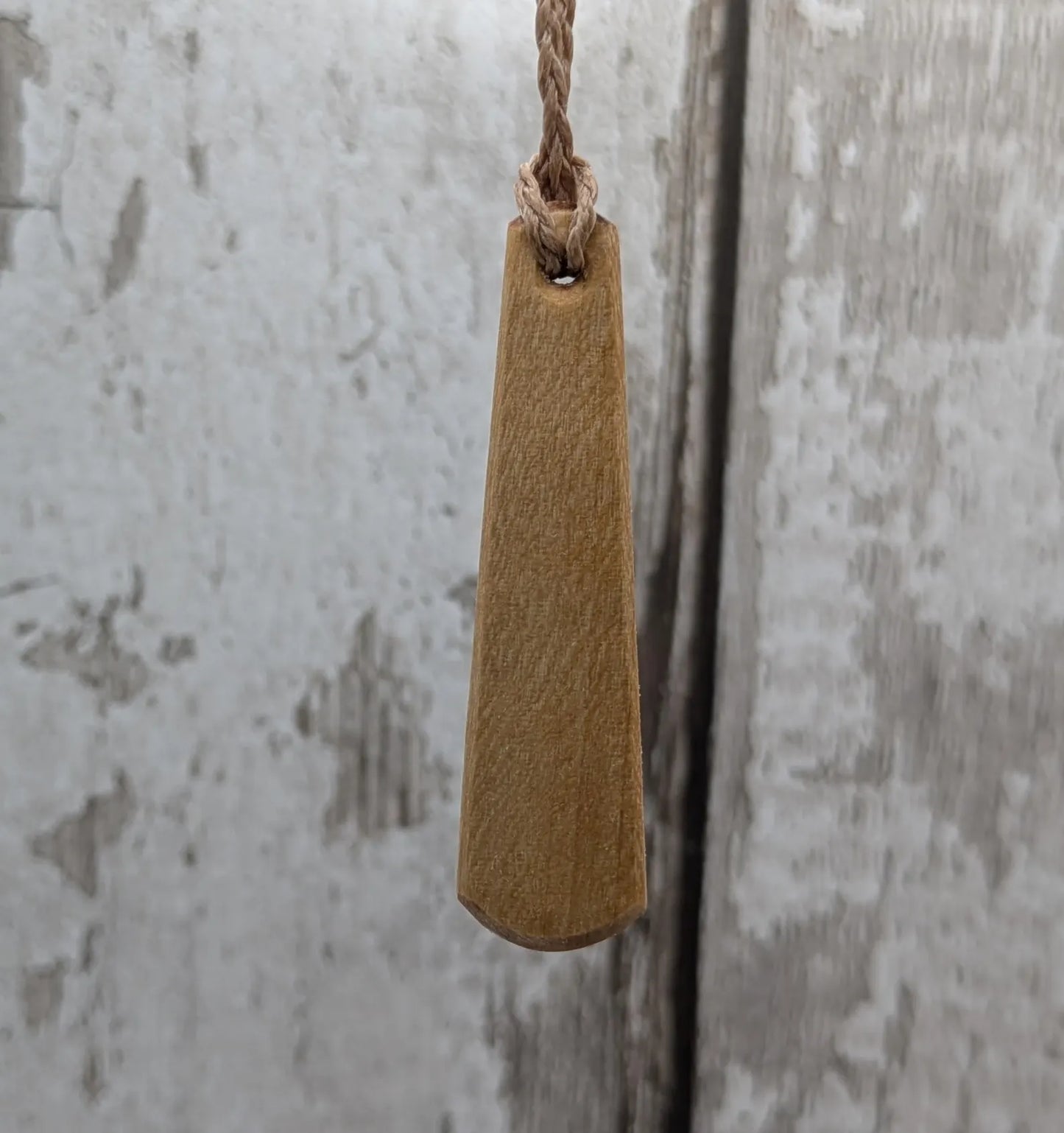 Lime wood Scots Gaelic Tha Mi Láidir, I am strong roimata drop pendant.