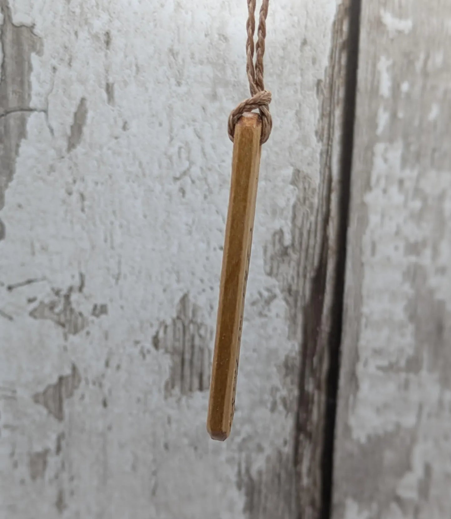 Lime wood Scots Gaelic Tha Mi Láidir, I am strong roimata drop pendant.