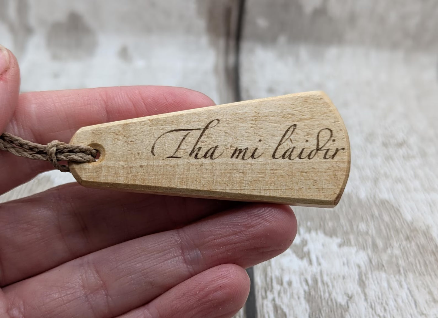Lime wood Scots Gaelic roimata pendant. Tha mi làidir, I am strong.
