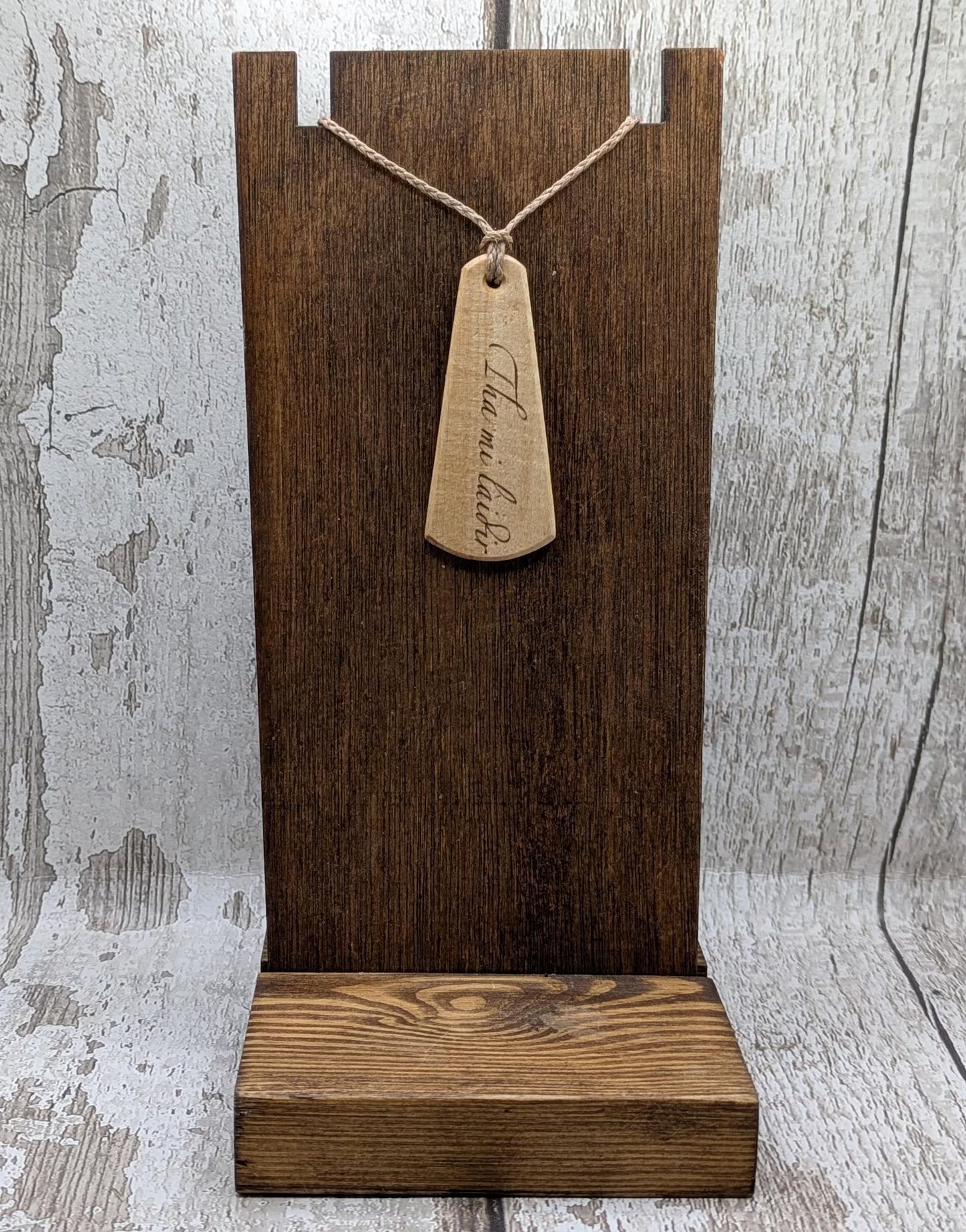 Lime wood Scots Gaelic roimata pendant. Tha mi làidir, I am strong.