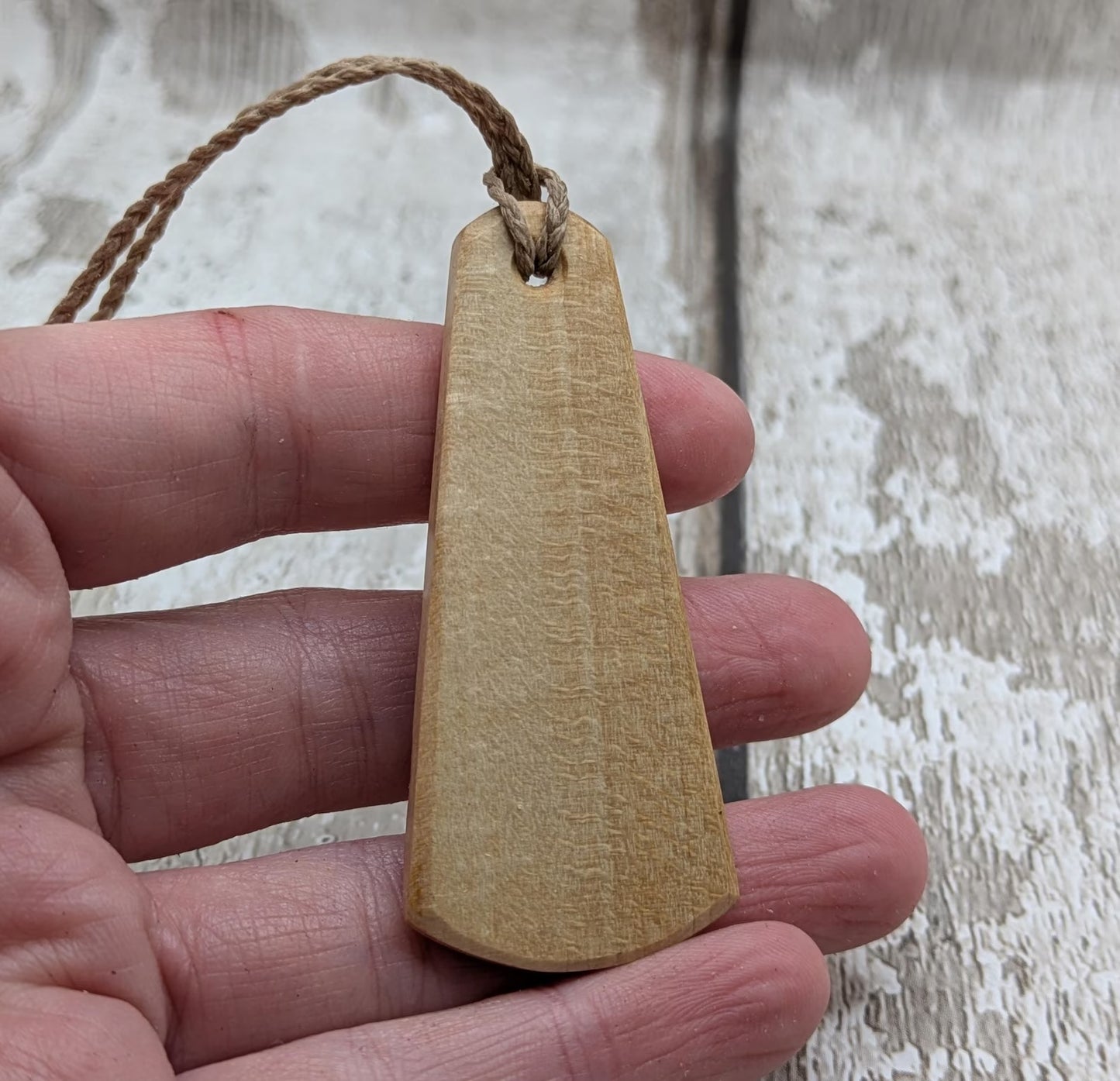 Lime wood Scots Gaelic roimata pendant. Tha mi làidir, I am strong.