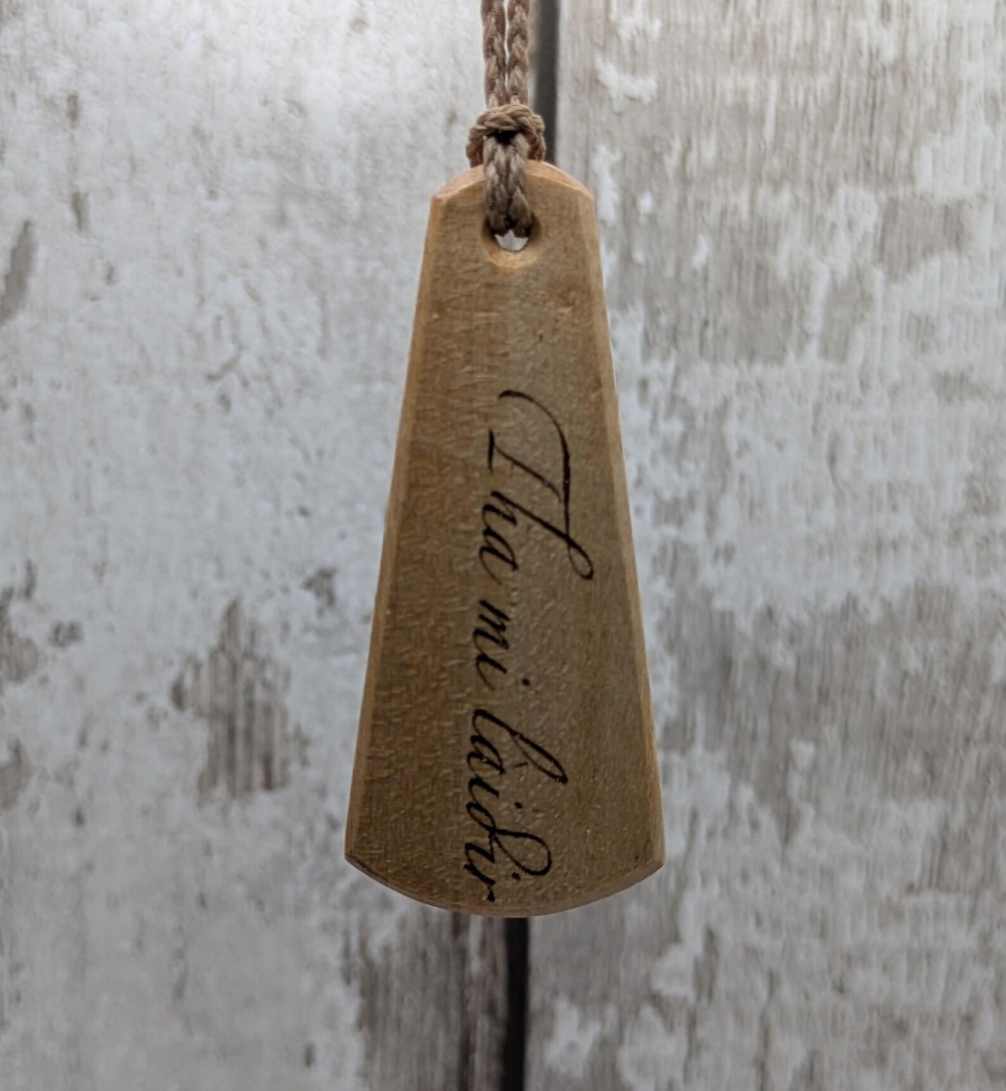 Lime wood Scots Gaelic roimata pendant. Tha mi làidir, I am strong.