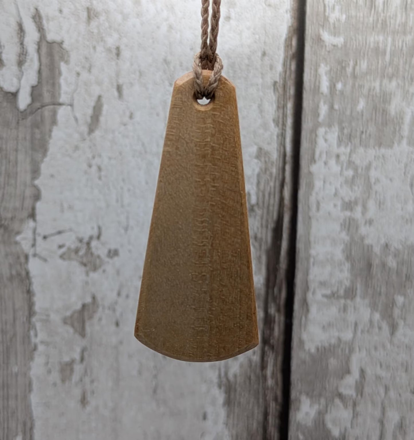 Lime wood Scots Gaelic roimata pendant. Tha mi làidir, I am strong.