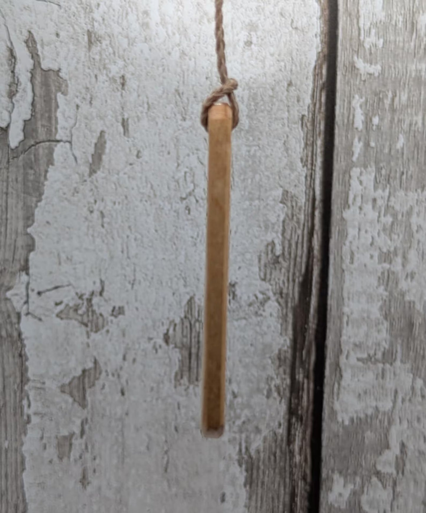 Lime wood Scots Gaelic roimata pendant. Tha mi làidir, I am strong.