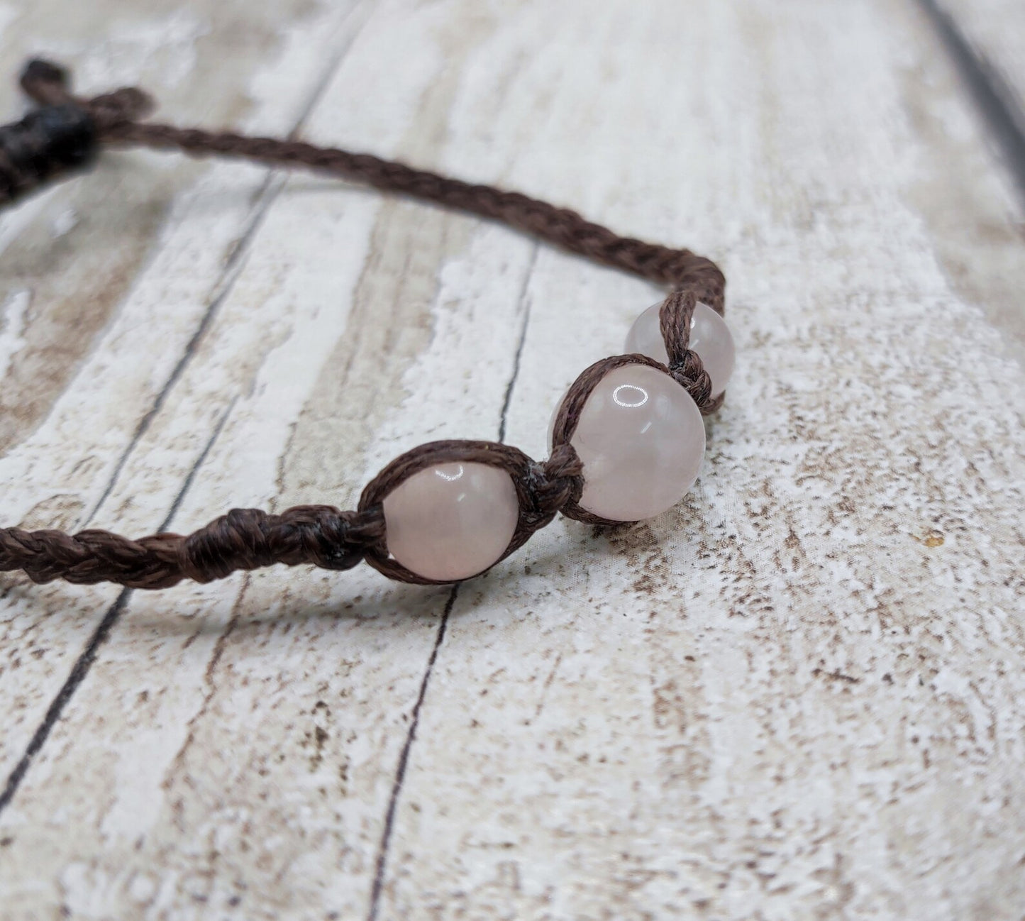 Rose quartz beaded macramé bracelet.