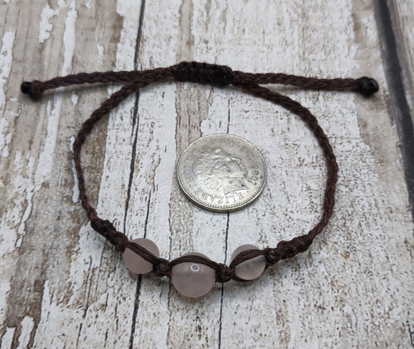 Rose quartz beaded macramé bracelet.