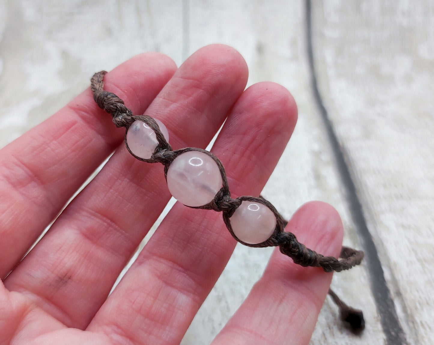 Rose quartz beaded macramé bracelet.
