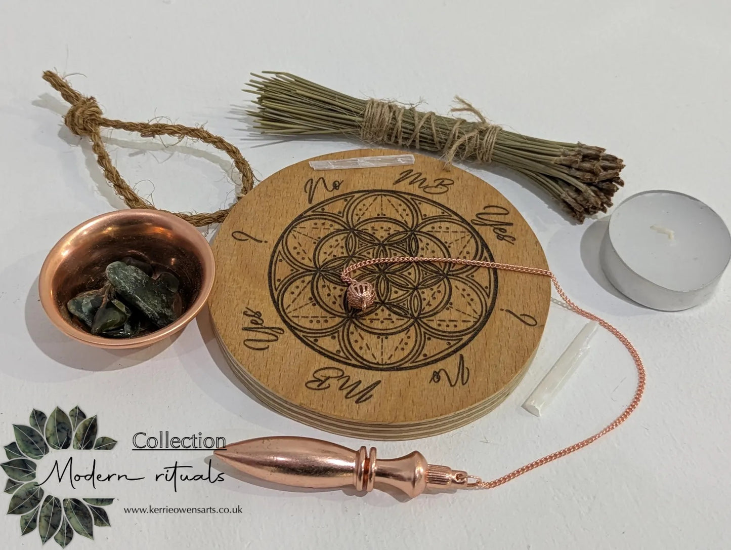 Recycled ply wood pendulum dowsing board with geometric design.