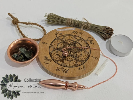 Recycled ply wood pendulum dowsing board with geometric design.