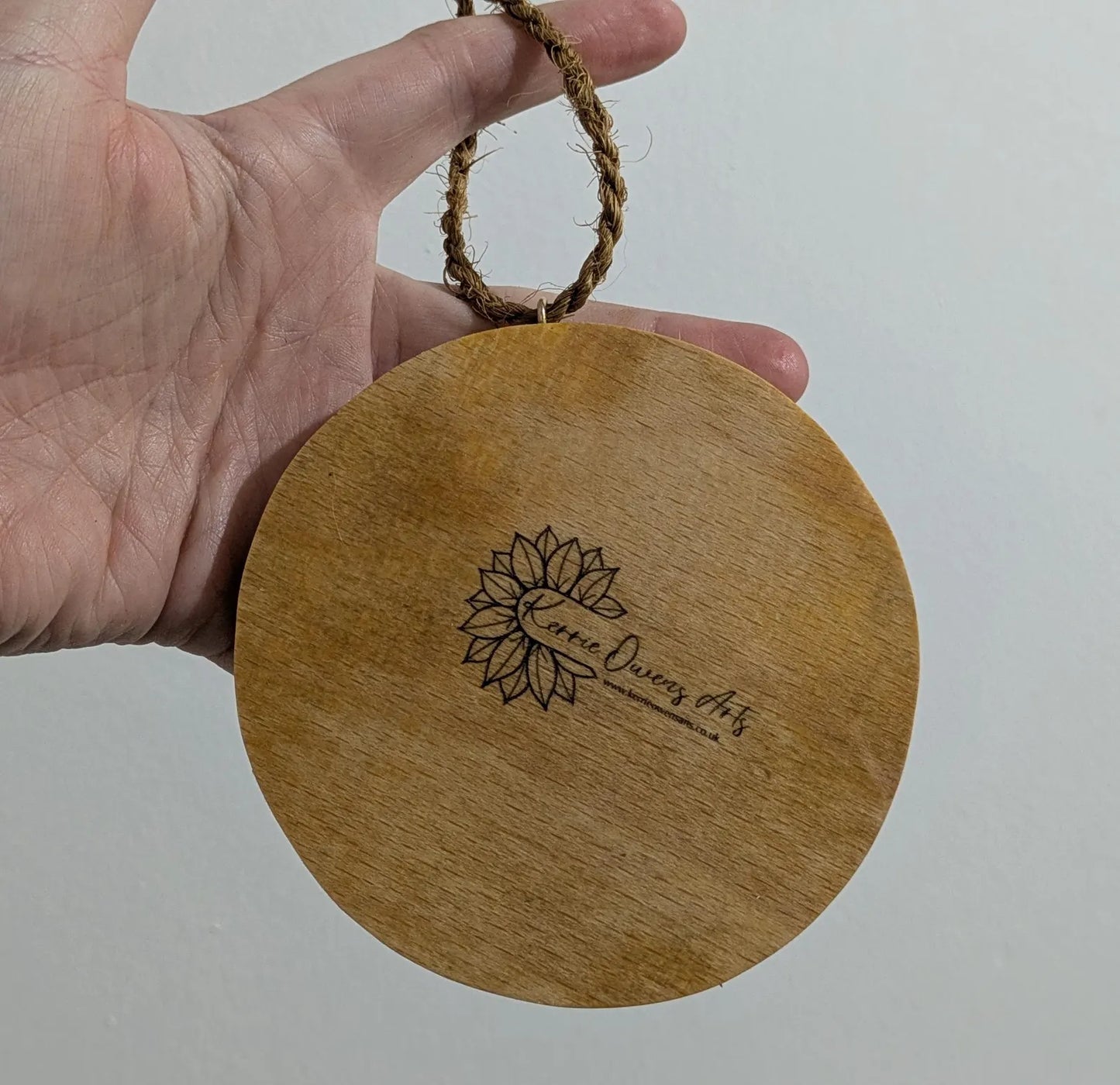 Recycled ply wood pendulum dowsing board with geometric design.
