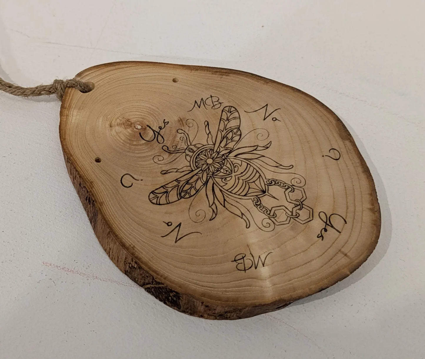 Ash wood hanging gilded bumble bee laser printed pendulum board.
