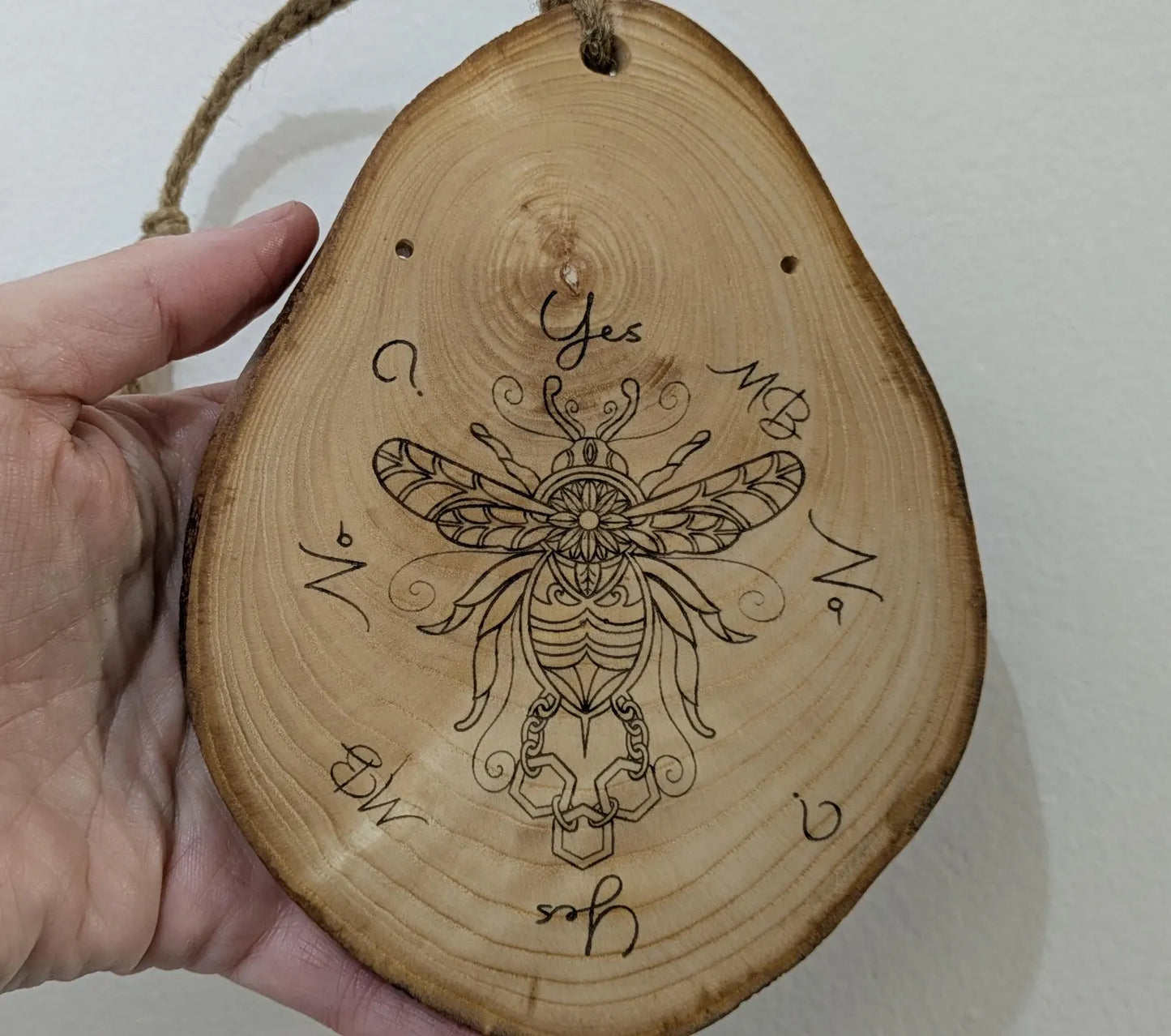 Ash wood hanging gilded bumble bee laser printed pendulum board.
