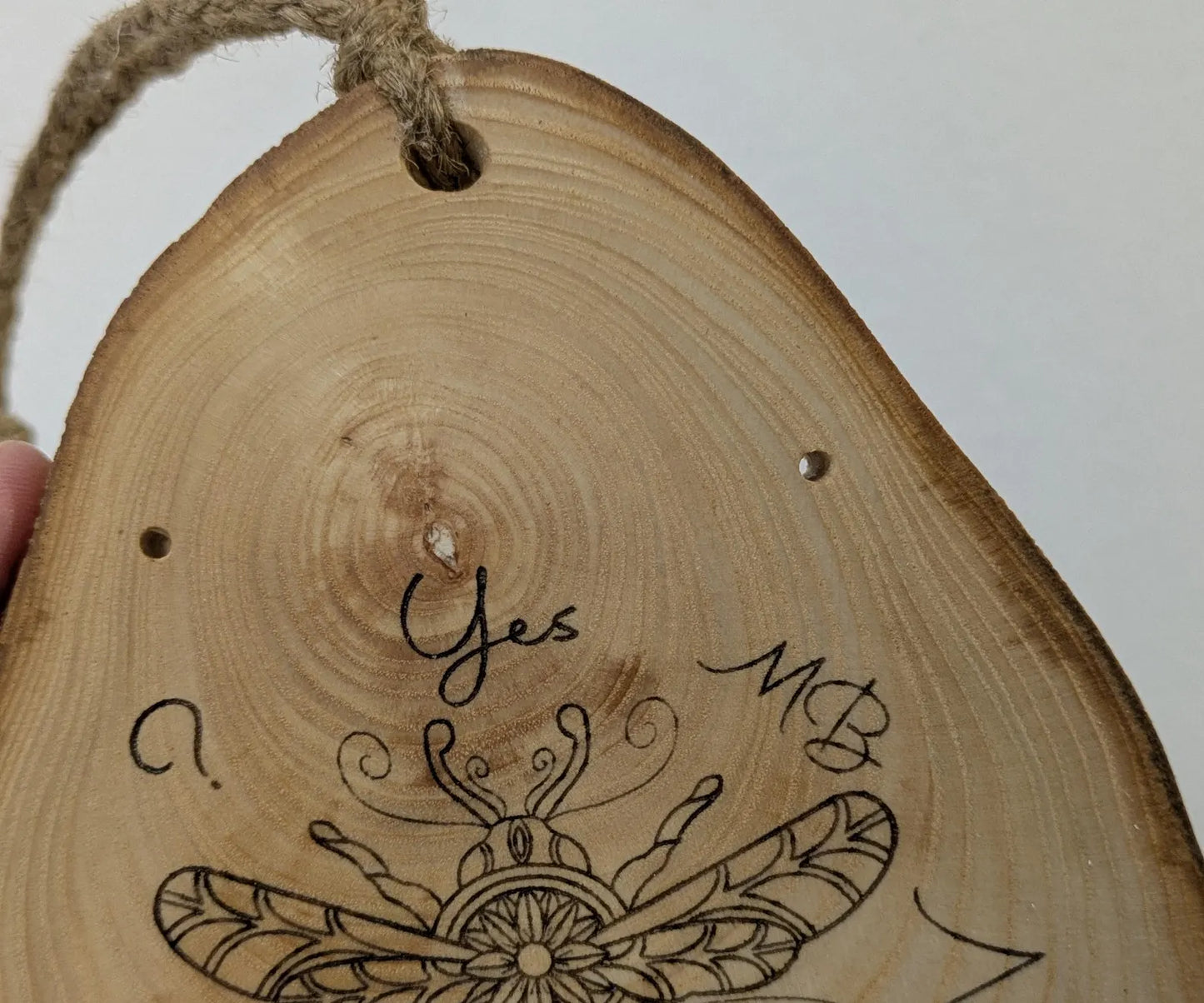 Ash wood hanging gilded bumble bee laser printed pendulum board.