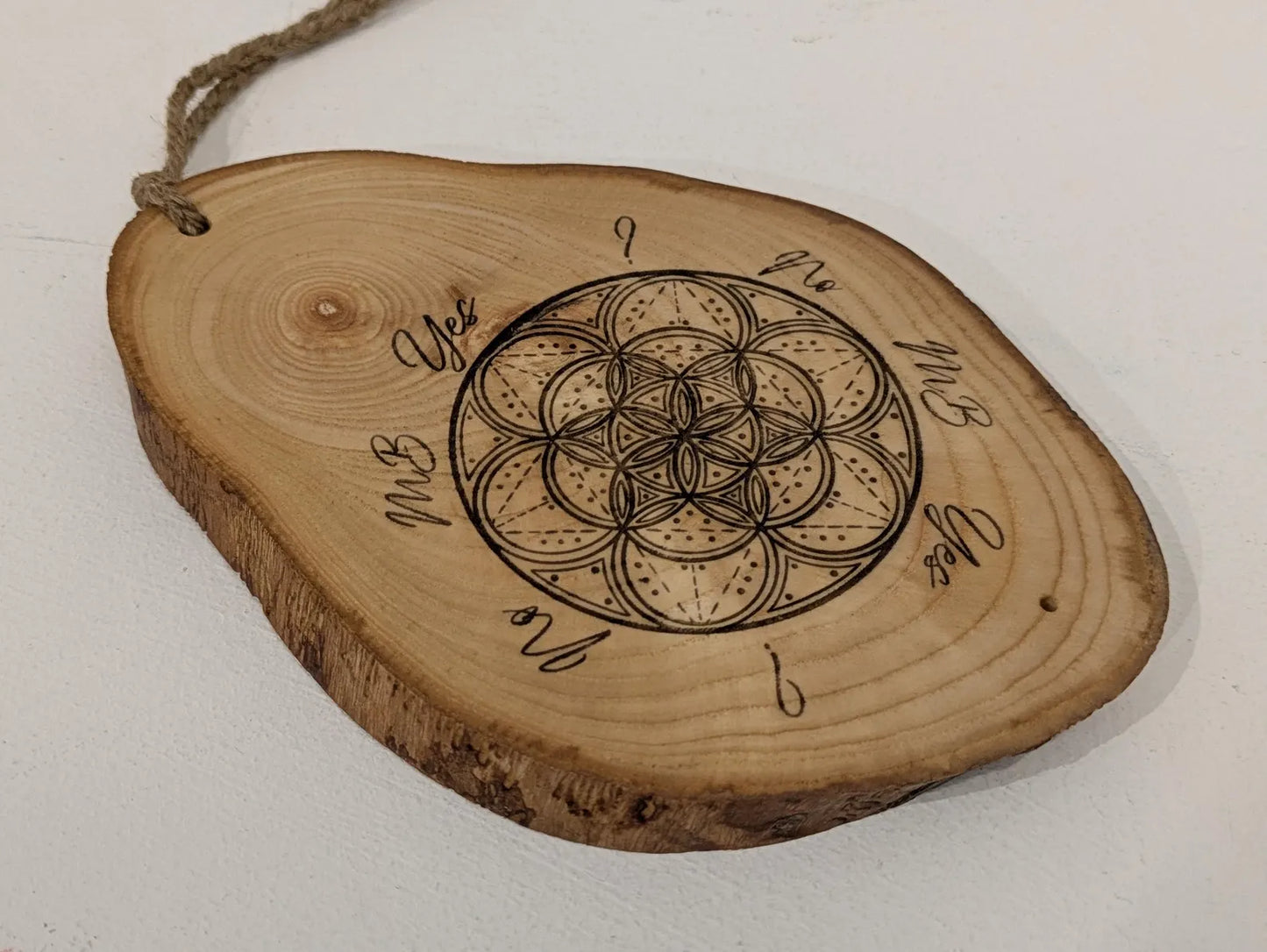 Ash wood geometric laser printed pendulum dowsing board.