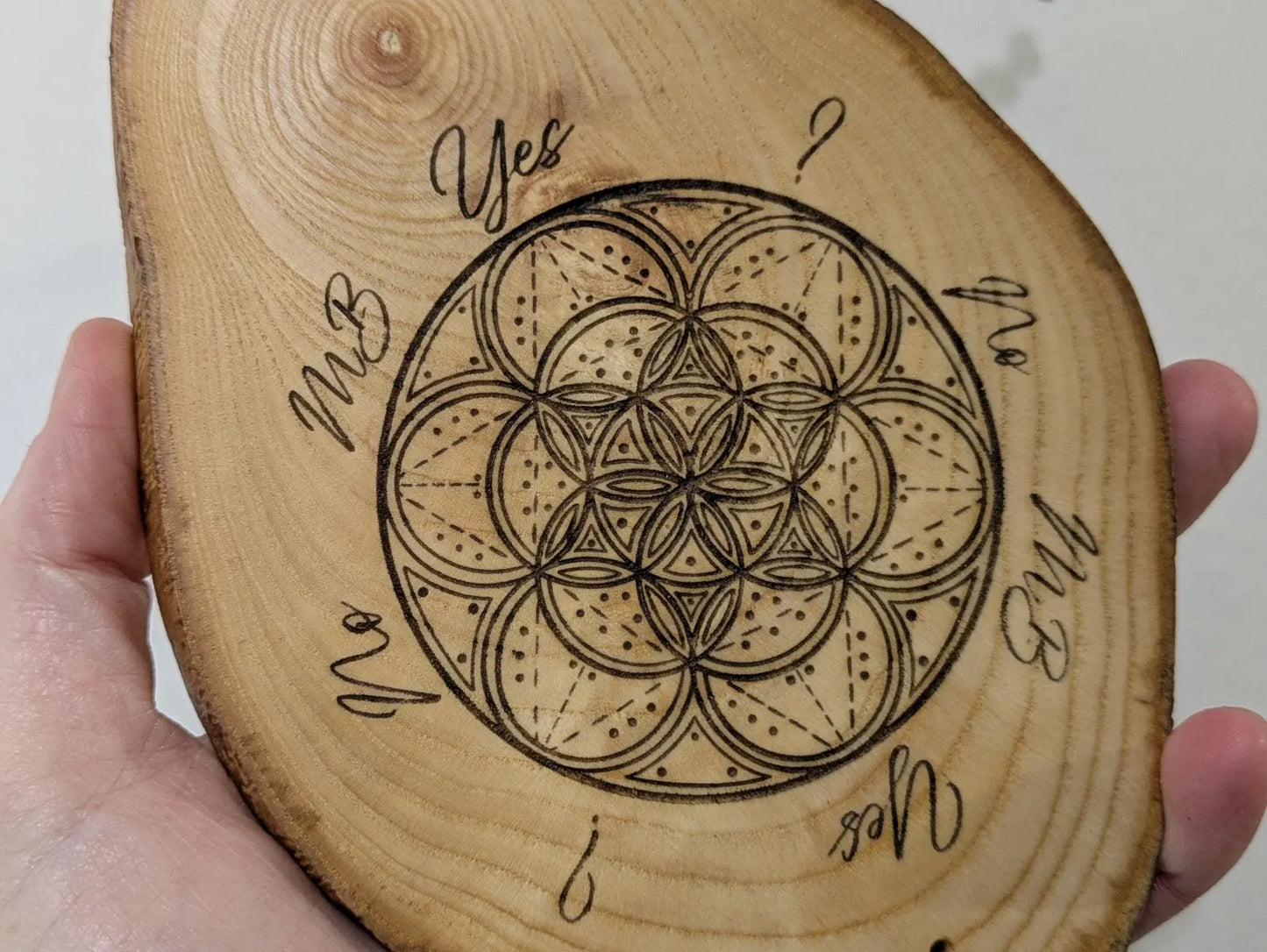 Ash wood geometric laser printed pendulum dowsing board.