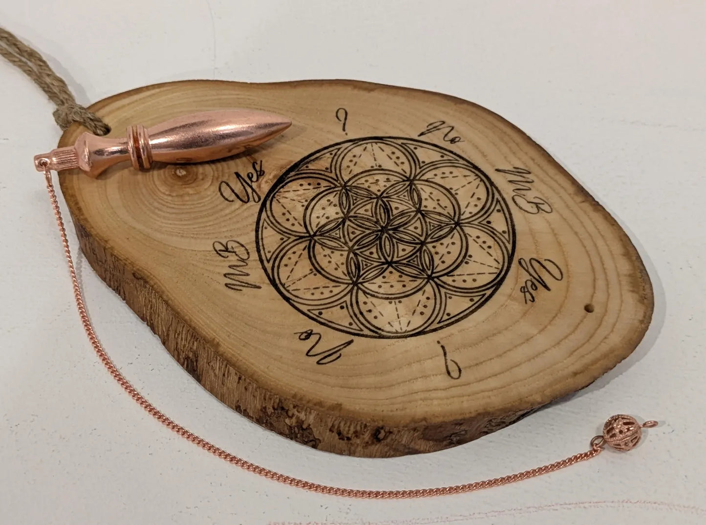 Ash wood geometric laser printed pendulum dowsing board.