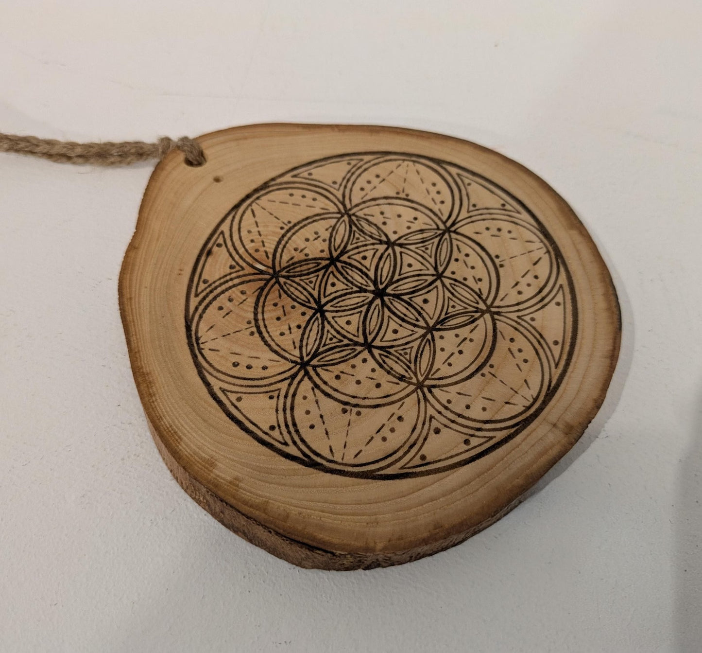 Ash wood hanging crystal grid board with incense drill holes.