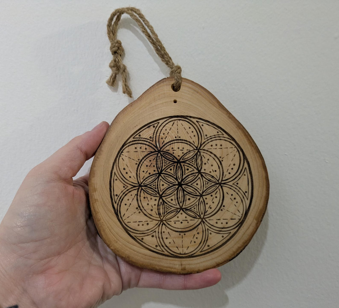 Ash wood hanging crystal grid board with incense drill holes.