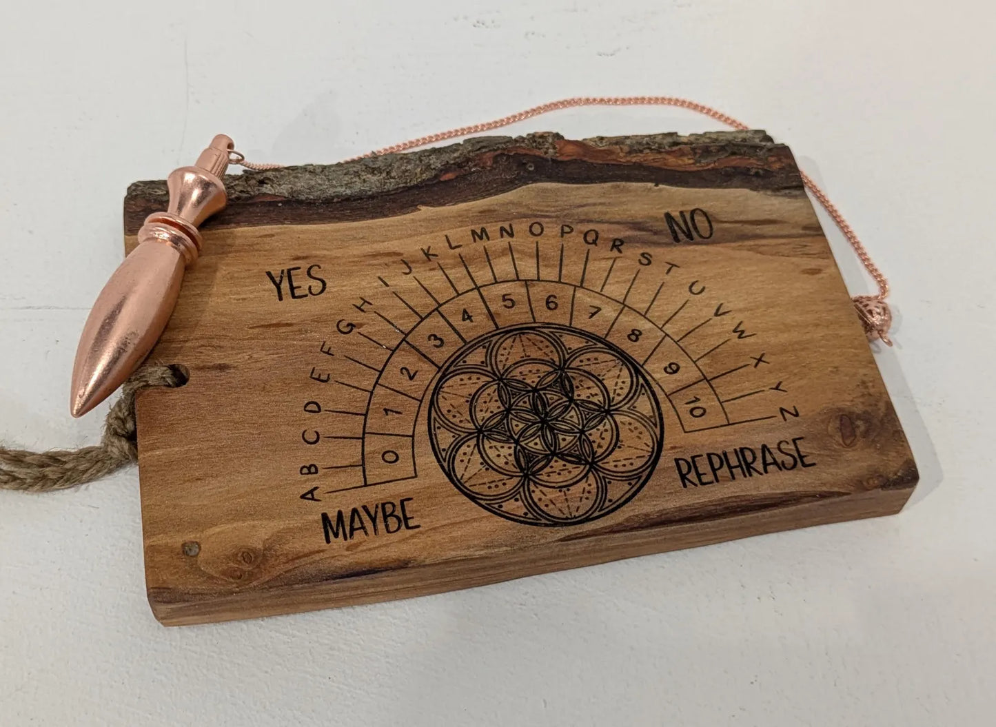 Alder wood hanging alphabet pendulum board with incense holder.